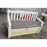 A PLASTIC GARDEN STORAGE BENCH