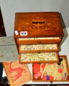 A MAH-JONG SET, bone and bamboo, housed in a table top five drawer cabinet, with two Mah Jong