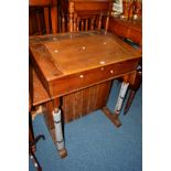 AN EARLY 20TH CENTURY LEDGER DESK with a hinged top, drop down flaps at each end and double cupboard