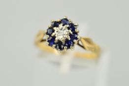 A 9CT GOLD SAPPHIRE AND DIAMOND CLUSTER RING, a central single cut diamond within an illusion