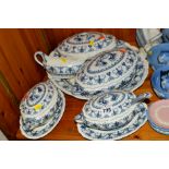 A PART BLUE AND WHITE DINNER SERVICE to include two tureens, two sauce tureens and stands (one