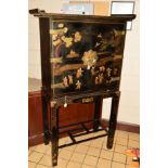 A 20TH CENTURY ORIENTAL BRASS BANDED TWO DOOR CABINET, on a seperate square frame base, black ground