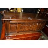 AN OAK LINENFOLD BLANKET CHEST