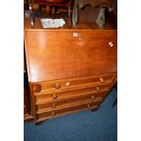 AN OAK FALL FRONT BUREAU above four drawers