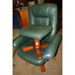 A DARK GREEN LEATHER SWIVEL CHAIR ON A WOODEN BASE, together with a matching stool (2)