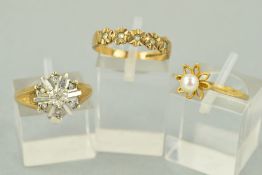 THREE 9CT GOLD DRESS RINGS, the first designed with a central cultured pearl within an open floral