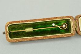 A VICTORIAN DIAMOND AND PEARL STICK PIN, estimated old European cut diamond 0.05ct, in original