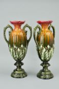 A PAIR OF TWIN HANDLED PEDESTAL VASES, with embossed No1893 to bases, approximate height 36.5cm (