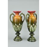 A PAIR OF TWIN HANDLED PEDESTAL VASES, with embossed No1893 to bases, approximate height 36.5cm (