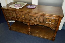 A TITCHMARSH AND GOODWIN OAK DRESSER BASE, the four drawers with geometric front, central rail