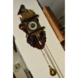 A DUTCH WALL CLOCK, with Roman numeral dial and brass motifs, with weights (some damage to wood at