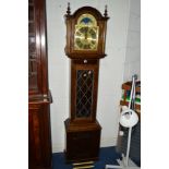 A MODERN OAK LONGCASE CLOCK, the brass face with Roman numerals (two weights and pendulum)