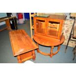 A MODERN RECTANGULAR CHERRYWOOD COFFEE TABLE with an undershelf, a matching circular coffee table