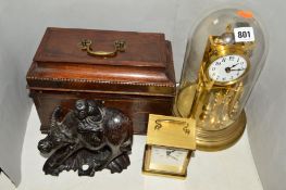 A DOMED ANNIVERSARY CLOCK, a Metamec carriage clock (batteries), a tea caddy with carry handle (no