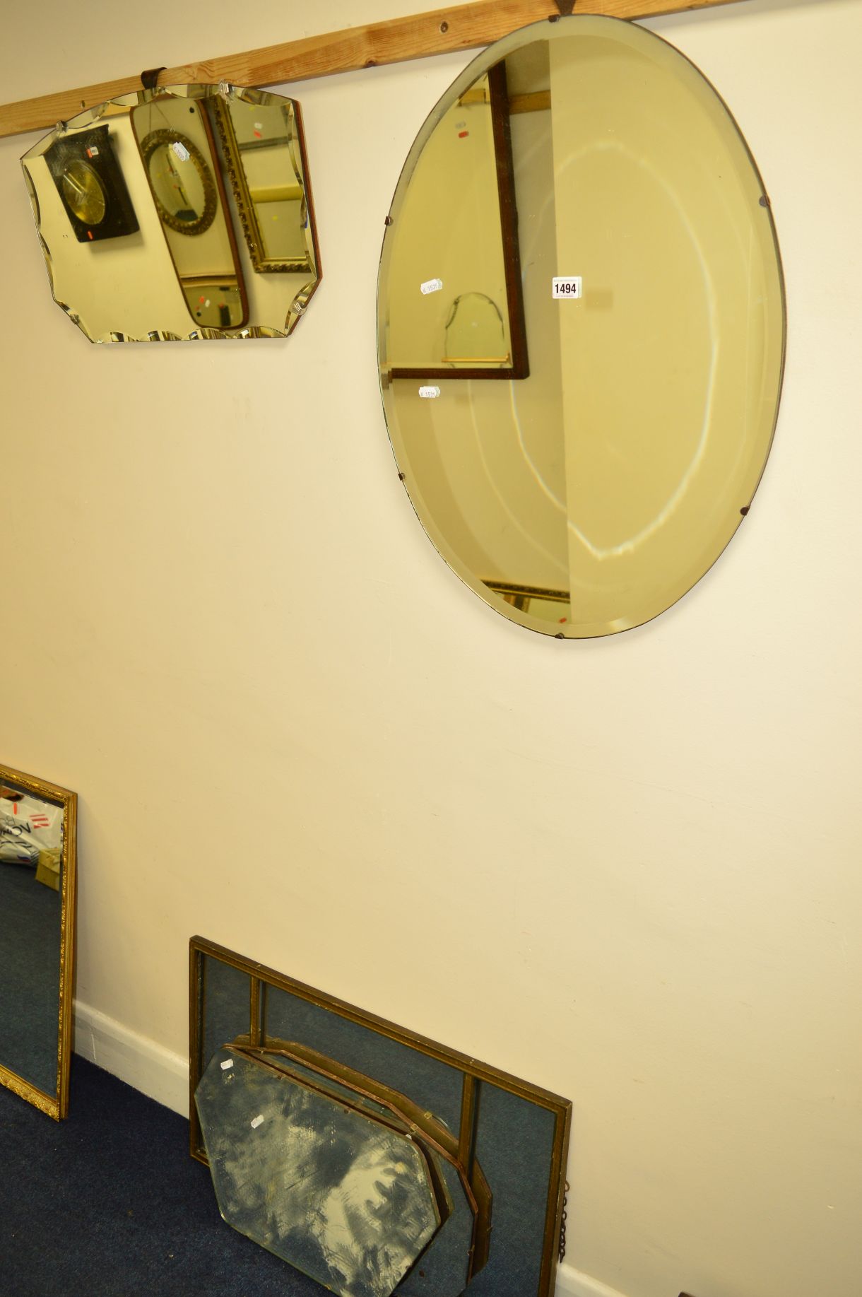 FOUR VARIOUS SHAPED WALL MIRRORS and another mirror (5)