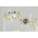 TWO 9CT GOLD GEM RINGS, the first a seven stone ring set with four circular sapphires and three