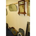 AN EDWARDIAN OAK WALL MIRROR/SHELF with ceramic plaque above, together with various brass framed