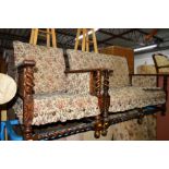 AN EARLY 20TH CENTURY OAK BARLEY TWIST TWO PIECE LOUNGE SUITE with floral upholstery, comprising