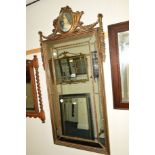 A MODERN GILT AND FOLIATE FRAMED WALL MIRROR, 55cm x 127cm, together with an Art Nouveau brass