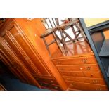 A YOUNGER CHERRYWOOD SEVEN PIECE BEDROOM SUITE comprising of a three door wardrobe, a two door