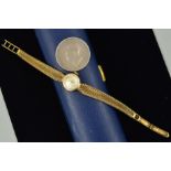 A 9CT GOLD LADYS TISSOT WRISTWATCH AND A GEORGE IV COIN, the watch with a circular face and baton