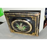 A LACQUERED WRITING SLOPE, with painted floral design and mother of pearl inlay, gilt edging (