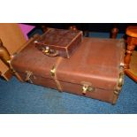 A VINTAGE TRAVELLING TRUNK, a small suitcase and a mahogany hexagonal coffee table (3)