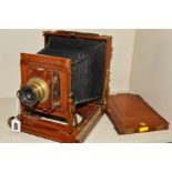 A THORNTON PICKARD PLATE CAMERA, with mahogany case and brass adornments and fitted with a