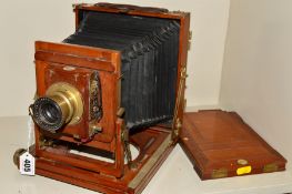 A THORNTON PICKARD PLATE CAMERA, with mahogany case and brass adornments and fitted with a