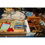 FOUR BOXES OF SUNDRIES, to include bedspread, pillow shams, linen, jigsaws, toys, wooden items, cork