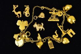 A CHARM MID TO LATE 20TH CENTURY CHARM BRACELET, trace link chain, together with fifteen assorted