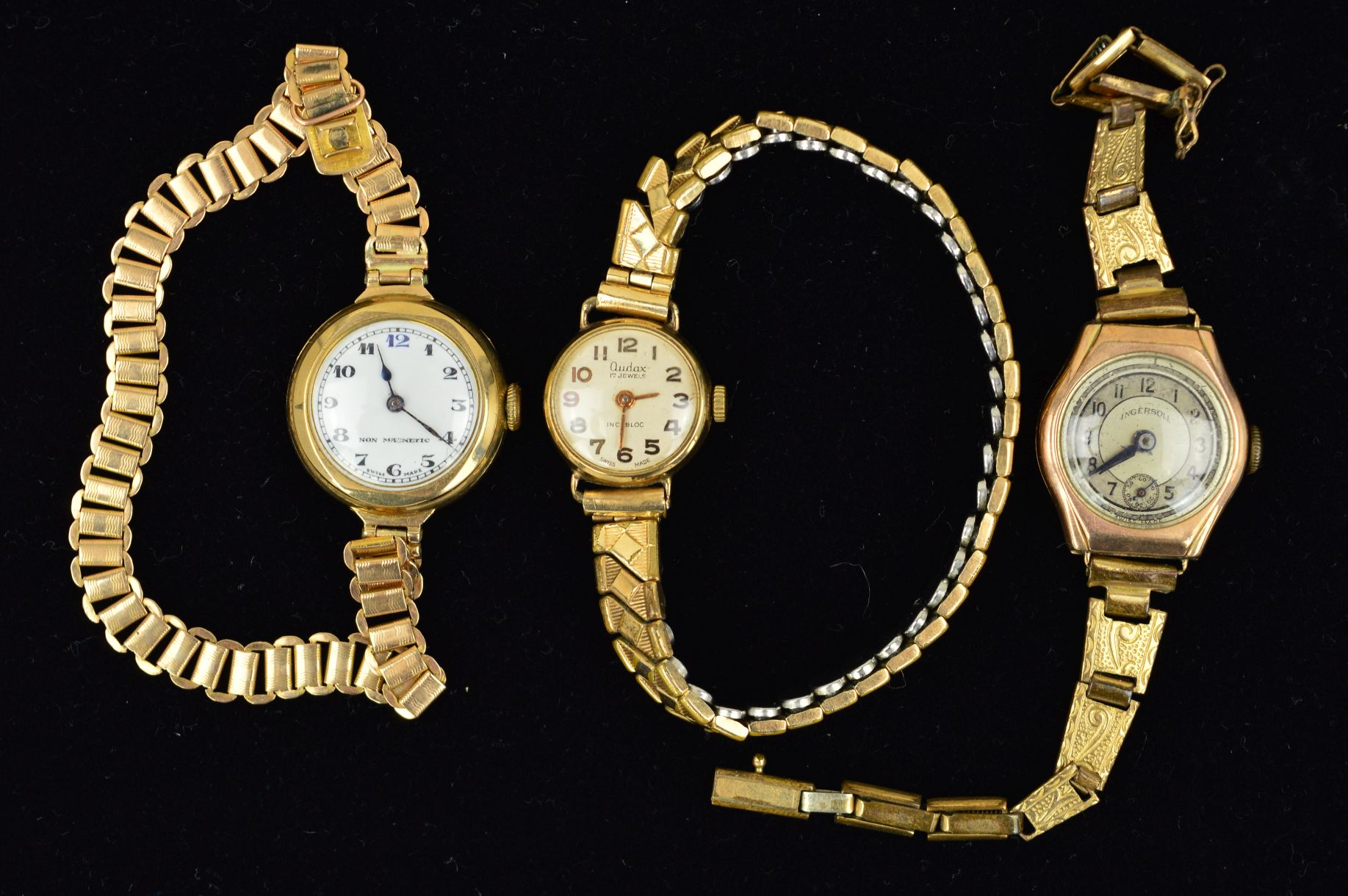 THREE WATCHES, the first a 9ct gold watch with circular head, the white face with Arabic numerals,