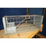 A GALVANISED STEEL RODENT TRAP