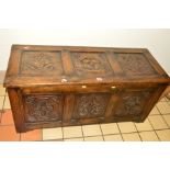 A REPRODUCTION OAK PANELLED BLANKET CHEST