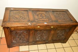 A REPRODUCTION OAK PANELLED BLANKET CHEST