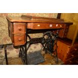 A SINGER TREADLE SEWING MACHINE