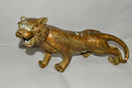 A BRASS ORIENTAL STYLE TIGER, approximate length 35cm