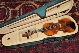 AN UNMARKED VIOLIN, with 33cm single piece back, ebonised tail piece, fingerboard and tuning pegs,