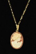 A CAMEO PENDANT AND CHAIN, the oval cameo depicting a lady in profile within a plain mount to the