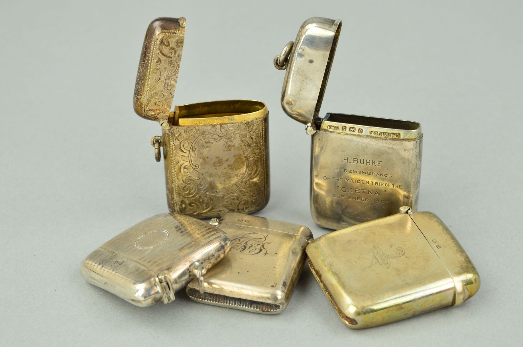 FIVE LATE 19TH TO EARLY 20TH CENTURY SILVER VESTA CASES, all of rectangular outlines, one with