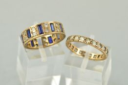 TWO ETERNITY RINGS, the first set with circular colourless pastes, size N, the second with