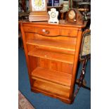 A REPRODUCTION CHERRYWOOD OPEN BOOKCASE with a single drawer, width 84cm x depth 35cm x height