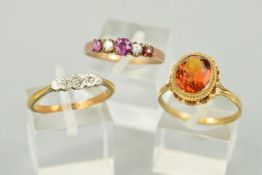 THREE GEM RINGS, the first a three stone, illusion set diamond ring, the central single cut