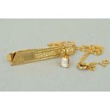 TWO ITEMS OF JEWELLERY to include a 9ct gold tie clip, engraved with a geometric pattern with a