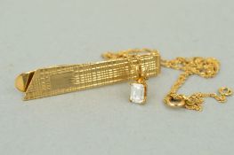 TWO ITEMS OF JEWELLERY to include a 9ct gold tie clip, engraved with a geometric pattern with a