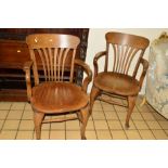 A PAIR OF EARLY 1920'S/30'S OAK OFFICE ARMCHAIRS