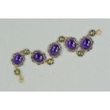 A MODERN AMETHYST AND PERIDOT FILIGREE PANEL BRACELET, measuring approximately 180mm in length,