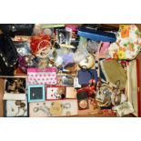 A BOX OF COSTUME JEWELLERY, compacts, earrings, silver locket, etc