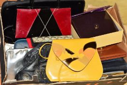 A BOX OF MAINLY VINTAGE HANDBAGS, etc, to include purple patent bag, a grey snakeskin clutch, a