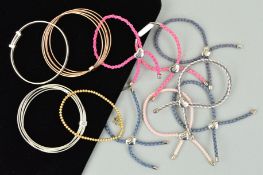 ELEVEN MOLLY BROWN BRACELETS AND BANGLES to include seven plaited cord bracelets with silver panels,